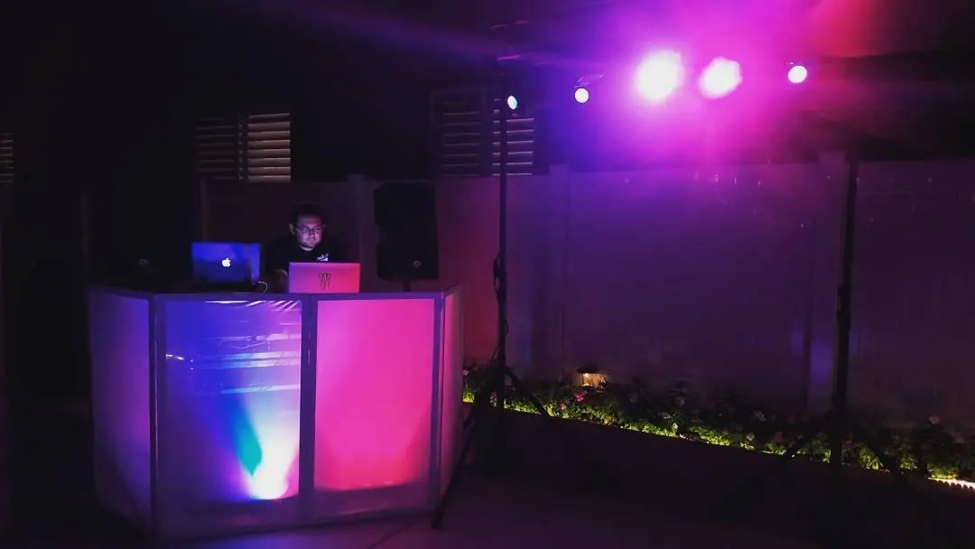 DJ setup illuminated with colorful lighting