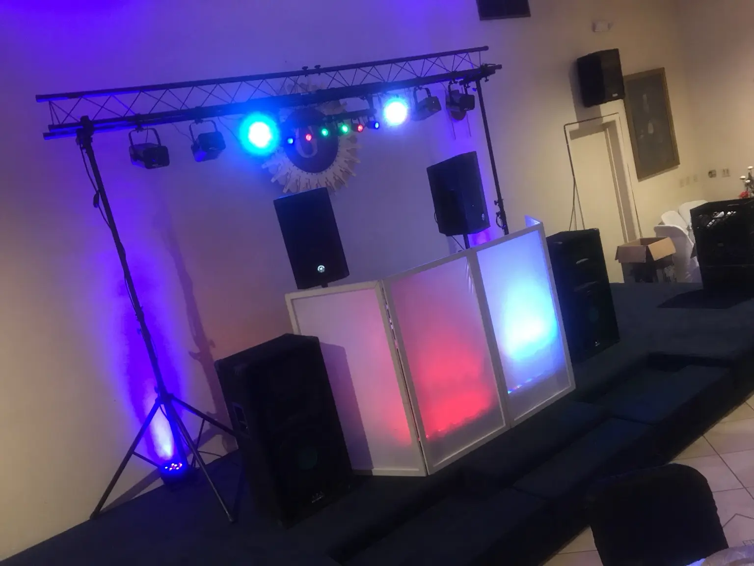DJ facade, speakers and overhead lighting rig